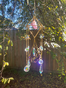 Caged crystal sun catchers